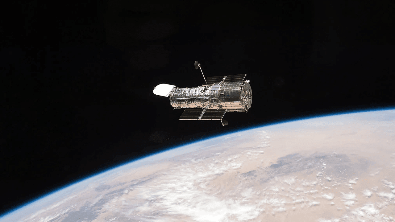 A Figure-Eight in Deep Space: Hubble Image Shows Gravity Warping Distant Galaxies