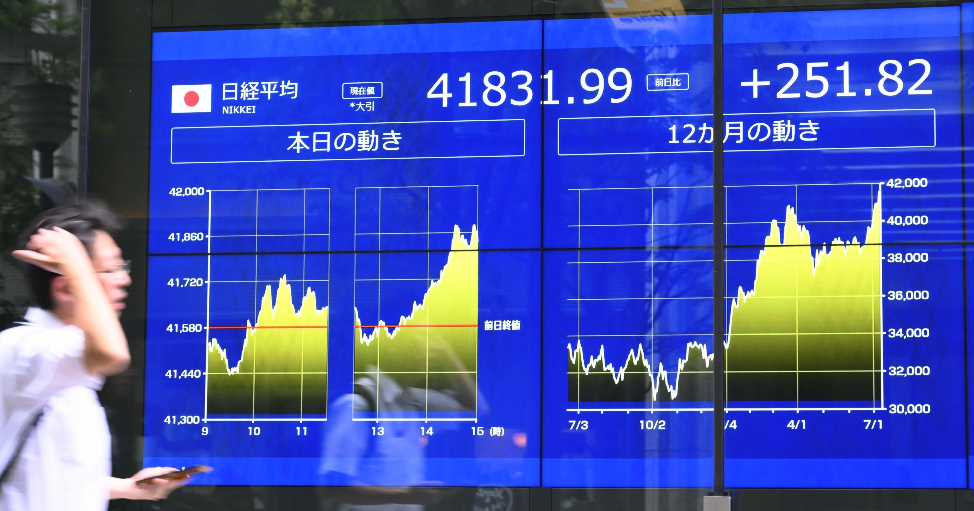 vna_potal_chung_khoan_tokyo_nhat_ban_lap_muc_cao_ky_luc_8953675.jpg